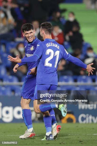 Carles Alena of Getafe CF celebrates scoring their third goal with teammate Juan Iglesias during the LaLiga Santander match between Getafe CF and...