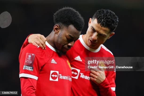 Cristiano Ronaldo of Manchester United consoles Anthony Elanga of Manchester United during the Emirates FA Cup Fourth Round match between Manchester...