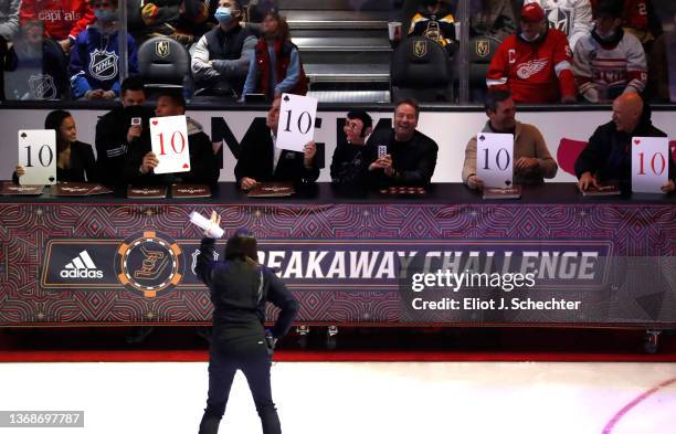 Judges hold up their scores during the Adidas NHL Breakaway Challenge during the 2022 NHL All-Star Skills as part of the 2022 NHL All-Star Weekend on...