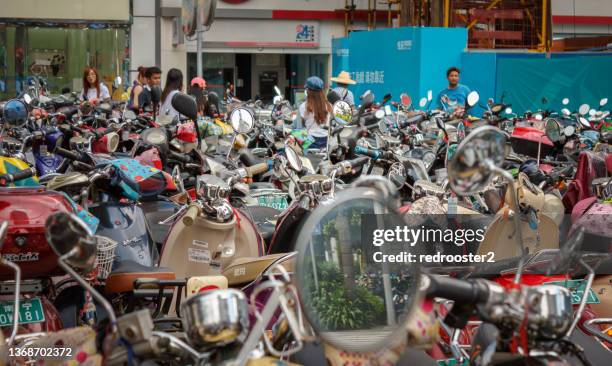 parking packed with electric bikes - nanning stock pictures, royalty-free photos & images