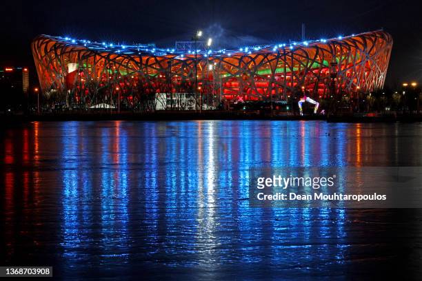 General View outside the National Stadium, also known as the Bird's Nest and Yangshan River as a firework display is seen above the Opening Ceremony...