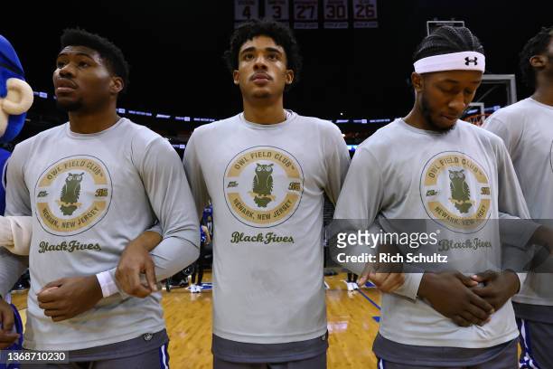 Alexis Yetna, Jared Rhoden and Myles Cale of the Seton Hall Pirates and their teammates wear shirts honoring the Newark Owl Field Club of the Black...