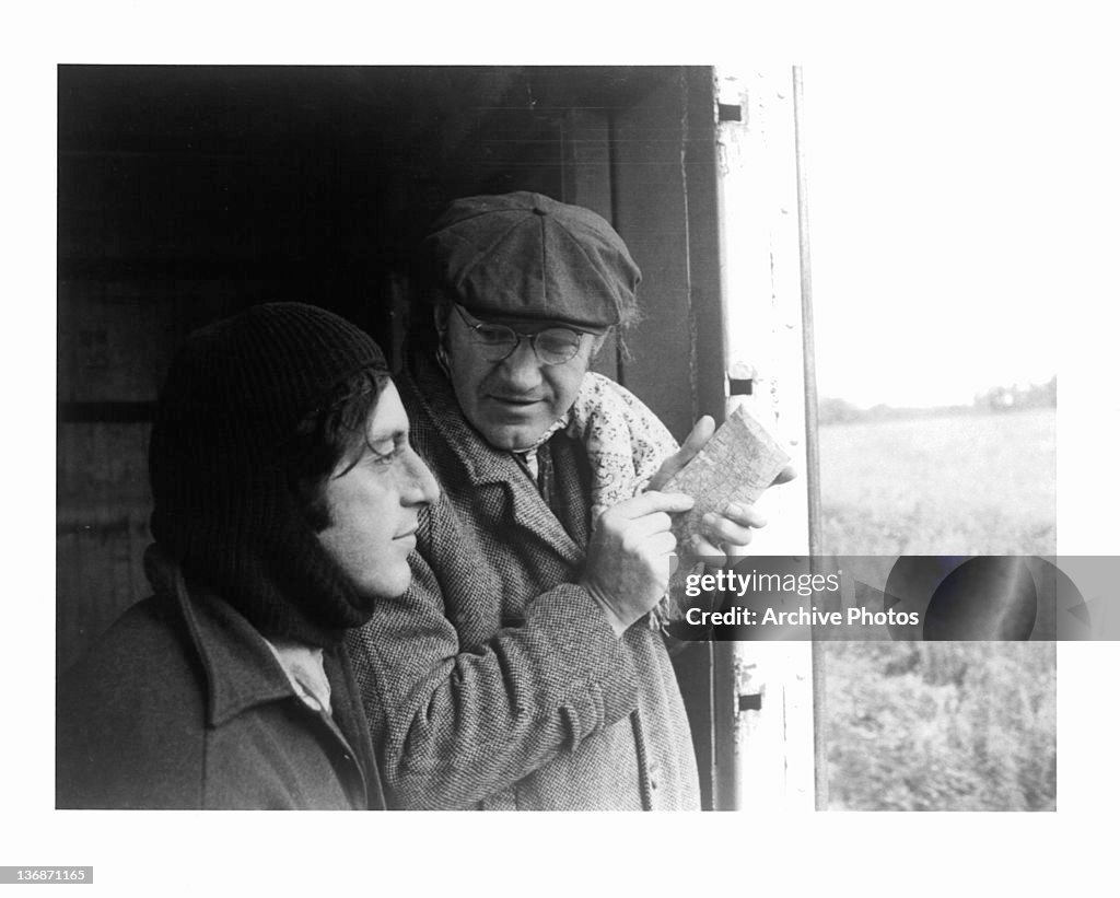 Al Pacino and Gene Hackman looking out a door and seeing a field in a