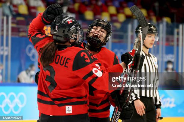 Sarah Nurse of Team Canada is congratulated by Erin Ambrose and Jocelyne Larocque after scoring a goal against Team Finland in the third period...