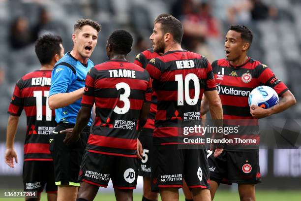 Wanderers players speaks during a time out with referee Jack Morgan after conceding a goal during the round 7 A-League match between Western Sydney...