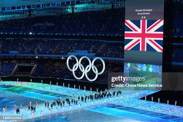 Flag bearers Eve Muirhead and Dave Ryding of Team Great Britain carry their flag during the Opening Ceremony of the Beijing 2022 Winter Olympics at...