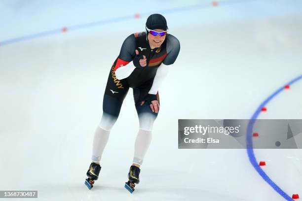 Claudia Pechstein of Team Germany reacts after skating during the Women's 3000m on day one of the Beijing 2022 Winter Olympic Games at National Speed...