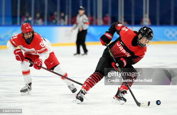 Rui Ukita of Team Japan challenges Michelle Weis of Team Denmark during the Women's Preliminary Round Group B match at Wukesong Sports Center on...