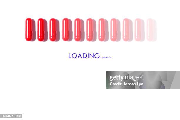 red capsule loading - progress bar stock pictures, royalty-free photos & images