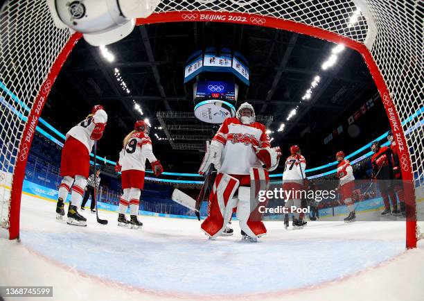 Akane Shiga of Team Japan celebrate with their team mates after scoring the 5th goal over Lisa Jensen, goaltender of Team Denmark during the Women's...