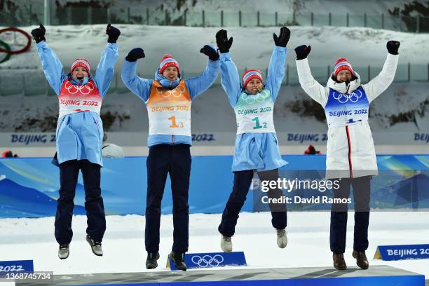 Marte Olsbu Roeiseland, Tarjei Boe, Tiril Eckhoff and Johannes Thingnes Boe of Team Norway celebrate after win the Biathlon Mixed Relay 4x6km during...