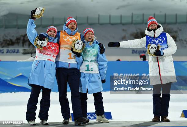 Marte Olsbu Roeiseland, Tarjei Boe, Tiril Eckhoff and Johannes Thingnes Boe of Team Norway celebrate after winning the Biathlon Mixed Relay 4x6km...