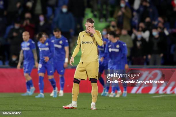 Carlos Clerc of Levante UD reacts as Getafe CF players celebrate their second goal during the LaLiga Santander match between Getafe CF and Levante UD...