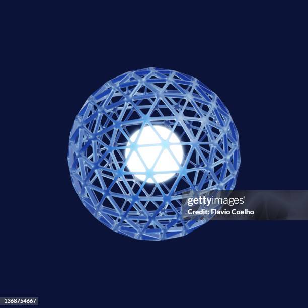 hollow blue globe with bright sphere in its center - nucleus - fotografias e filmes do acervo