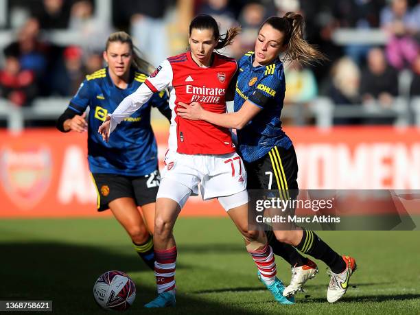 Tobin Heath of Arsenal holds off pressure from Ella Toone of Manchester United during the Barclays FA Women's Super League match between Arsenal...