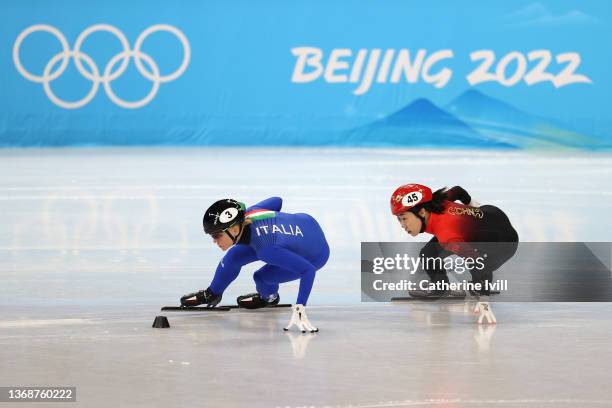 Arianna Fontana of Team Italy and Yuting Zhang of Team China compete during the Women's 500m Heats on day one of the Beijing 2022 Winter Olympic...