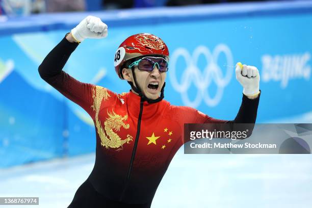 Dajing Wu of Team China celebrates after winning the Mixed Team Relay Final A on day one of the Beijing 2022 Winter Olympic Games at Capital Indoor...