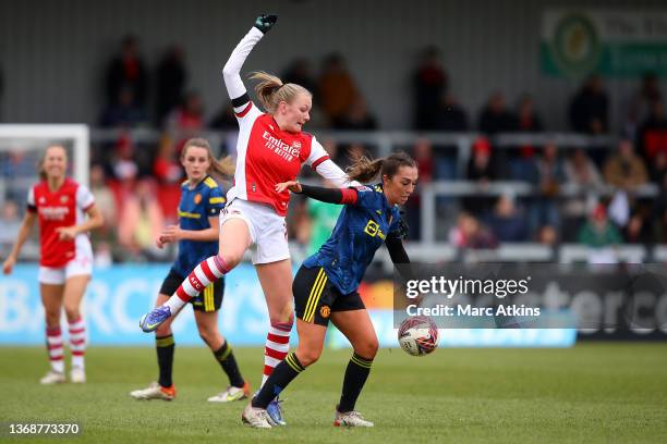 Katie Zelem of Manchester United holds off pressure from Frida Maanum of Arsenal during the Barclays FA Women's Super League match between Arsenal...