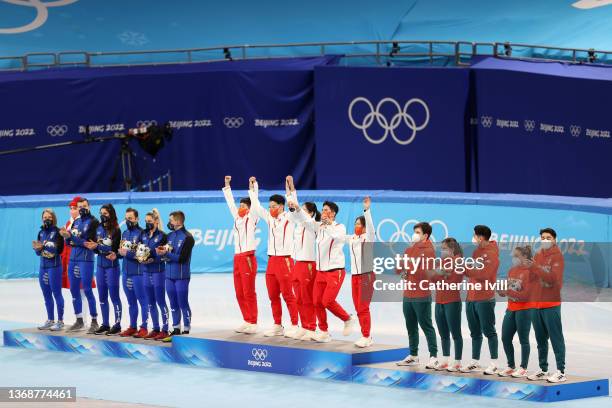 Gold medallists Team China , Silver medallists Team Italy and Bronze medallists Team Hungary pose during the Mixed Team Relay Final flower ceremony...