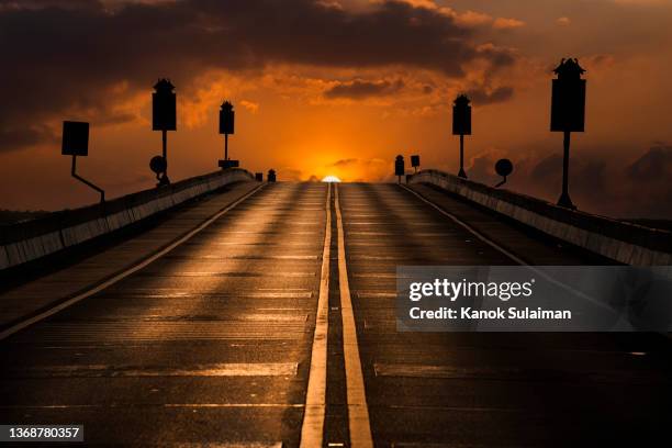 sunrise and sunset over empty road - moody sky stock pictures, royalty-free photos & images