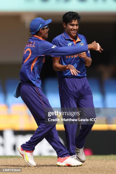 Raj Bawa and Yash Dhull celebrate as Raj Bawa gets his fifth wicket during the ICC U19 Men's Cricket World Cup Final match between England and India...