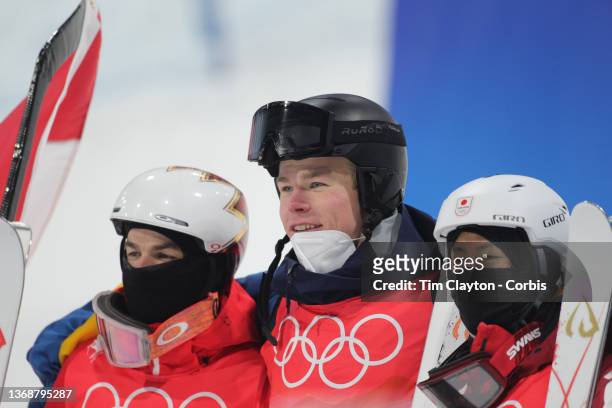 February 05: Walter Wallberg of Sweden after winning the gold medal with silver medalist Mikael Kingsbury of Canada and bronze medalist Ikuma...