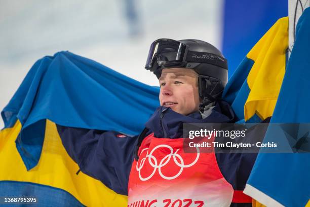 February 05: Walter Wallberg of Sweden celebrates after winning the gold medal in the Moguls Final for Men at the Genting Snow Park during the...