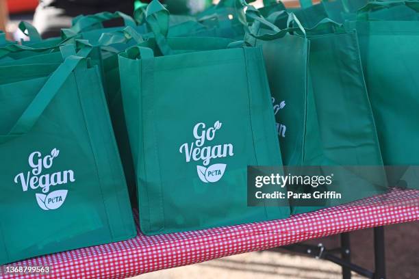 Vegan food starter kits display "Go Vegan" at The King’s Table Food Pantry hosted by PETA, Jermaine Dupri, Pastor Jamal Bryant, and Pinky Cole at New...