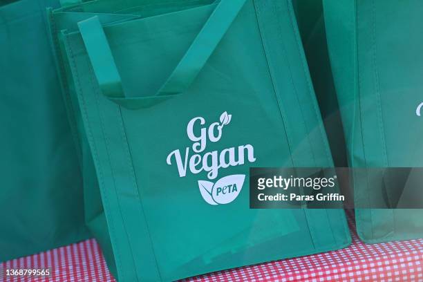 Vegan food starter kits display "Go Vegan" at The King’s Table Food Pantry hosted by PETA, Jermaine Dupri, Pastor Jamal Bryant, and Pinky Cole at New...