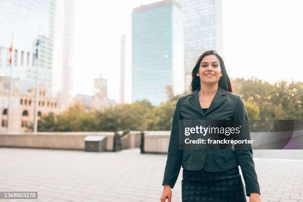 business woman standing in montreal downtown - montreal downtown stock pictures, royalty-free photos & images