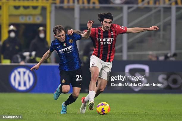 Nicolo Barella of FC Internazionale is challenged by Sandro Tonali of AC Milan during the Serie A match between FC Internazionale and AC Milan at...