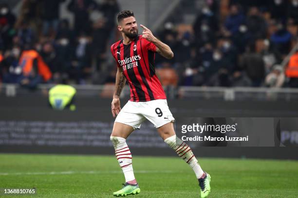 Olivier Giroud of AC Milan celebrates after scoring their team's first goal during the Serie A match between FC Internazionale and AC Milan at Stadio...