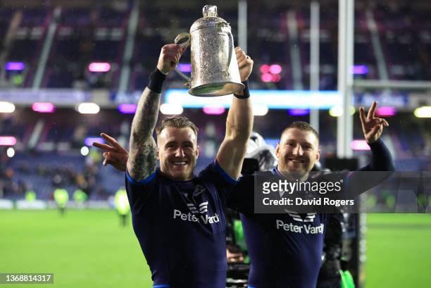 Stuart Hogg and Finn Russell of Scotland celebrate with the Calcutta Cup after victory in the Guinness Six Nations match between Scotland and England...