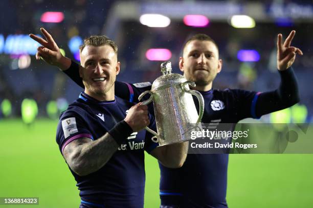 Stuart Hogg and Finn Russell of Scotland celebrate with the Calcutta Cup after victory in the Guinness Six Nations match between Scotland and England...