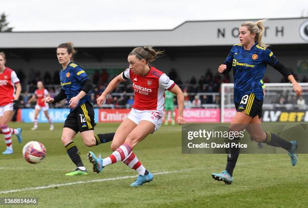 Katie McCabe of Arsenal crosses the ball as Alessia Russo of Man Utd looks on during the Barclays FA Women's Super League match between Arsenal Women...