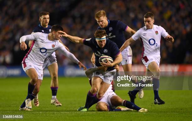 Hamish Watson of Scotland is tackled by Ben Youngs and Max Malins of England during the Guinness Six Nations match between Scotland and England at BT...