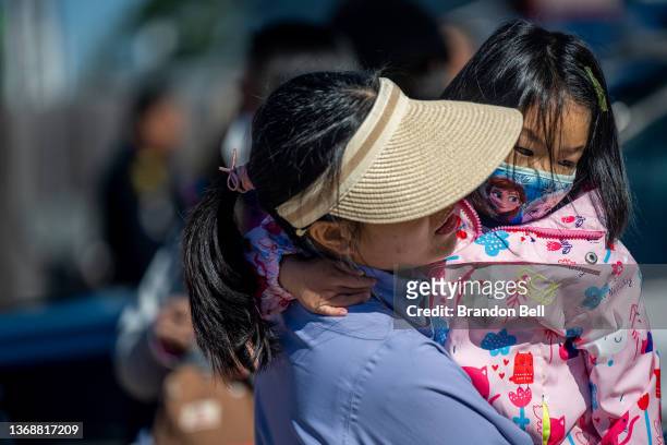 Mother bonds with her child during a Lunar New Year Festival at the Chinese Community Center on February 05, 2022 in Houston, Texas. Community...