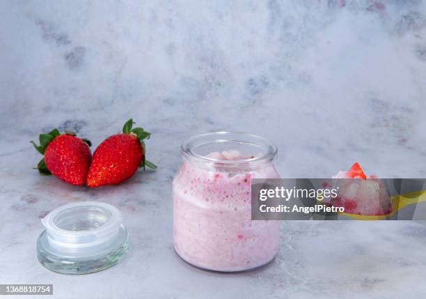 strawberry milked rice - yoghurt lid stock pictures, royalty-free photos & images