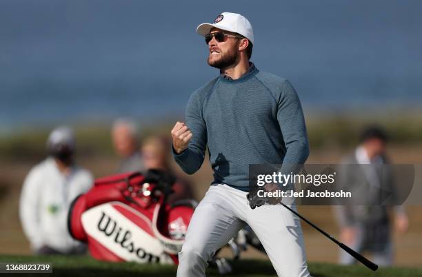 Scott Eastwood, actor and producer, reacts to making a birdie on the 11th hole during the third round of the AT&T Pebble Beach Pro-Am at the Monterey...