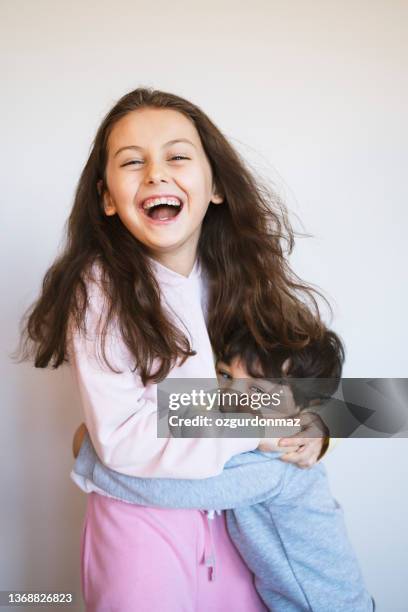 siblings playing on bed at home, daylight photo shoot, childhood concept - brother sister stock pictures, royalty-free photos & images