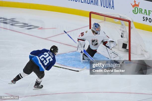 Jordan Kyrou of the St. Louis Blues makes a shot on goal against Andrei Vasilevskiy of the Tampa Bay Lightning during the game between the Atlantic...