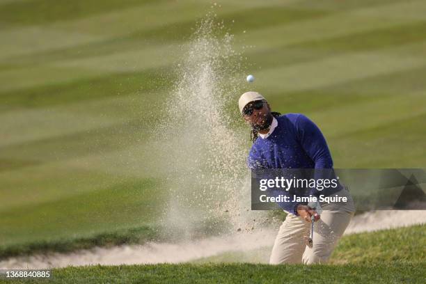 Amateur Larry Fitzgerald, NFL player, plays a shot from a greenside bunker on the eighth hole during the third round of the AT&T Pebble Beach Pro-Am...