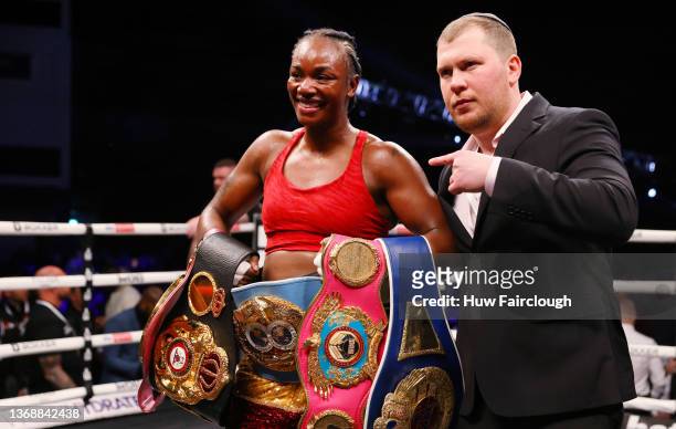 Claressa Shields celebrates victory with their belts after the WBO, WBA, IBO AND WBF Women's Middleweight Title fight between Claressa Shields and...