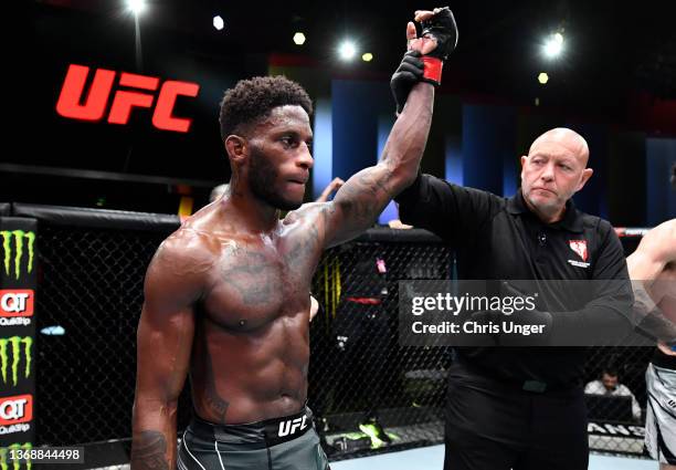 Hakeem Dawodu of Canada reacts after his victory over Michael Trizano in their featherweight fight during the UFC Fight Night event at UFC APEX on...