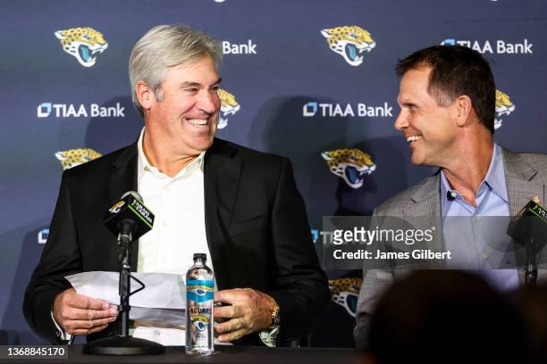 Doug Pederson talks with Trent Baalke, General Manager of the Jacksonville Jaguars, during a press conference introducing him as the new Head Coach...
