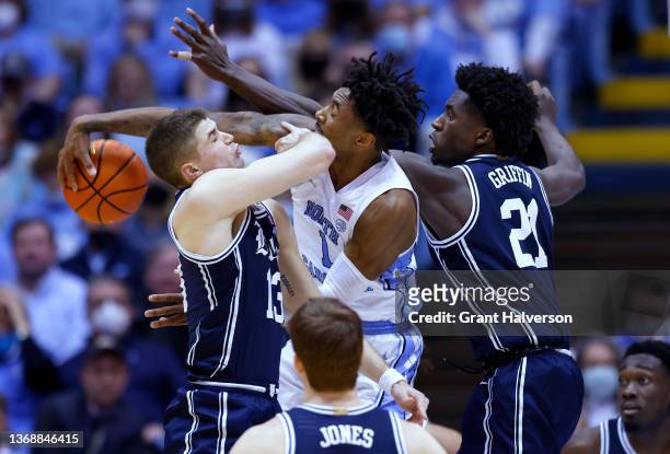 Leaky Black of the North Carolina Tar Heels battles Joey Baker and A.J. Griffin of the Duke Blue Devils for a rebound during the first half of their...