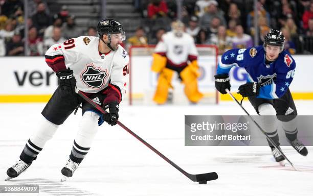 Cdnk plays the puck through the neutral zone during the 2022 NHL All-Star game between the Metropolitan Division and the Central Division at T-Mobile...