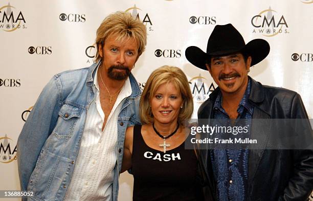 Ronnie Dunn, wife Janine Dunn, and Kix Brooks during 37th Annual CMA Awards - Arrivals at The Grand Ole Opry in Nashville, TN, United States.