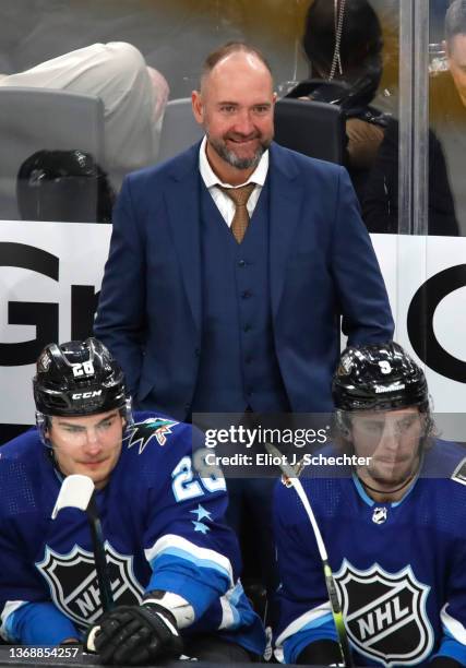 Head coach Peter DeBoer of the Vegas Golden Knights of the Pacific Division smiles from the bench area during the 2022 NHL All-Star game between the...