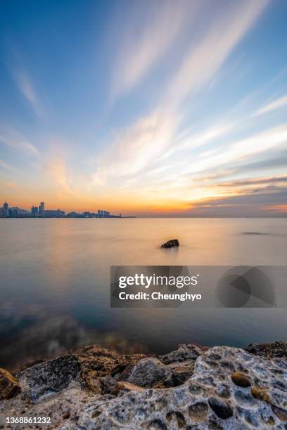 magnificent sunrise glow over qingdao city, shandong province, china, east asia - recife skyline imagens e fotografias de stock